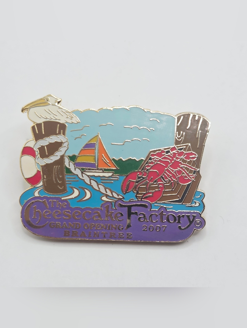 CHEESECAKE FACTORY PIN BRAINTREE GRAND OPENING 2007 LOBSTER PELICAN SAILBOATS